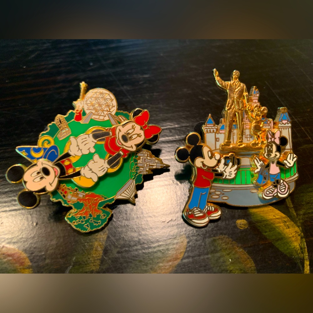 2 collectible Disney pins featuring Mickey and Minnie Mouse